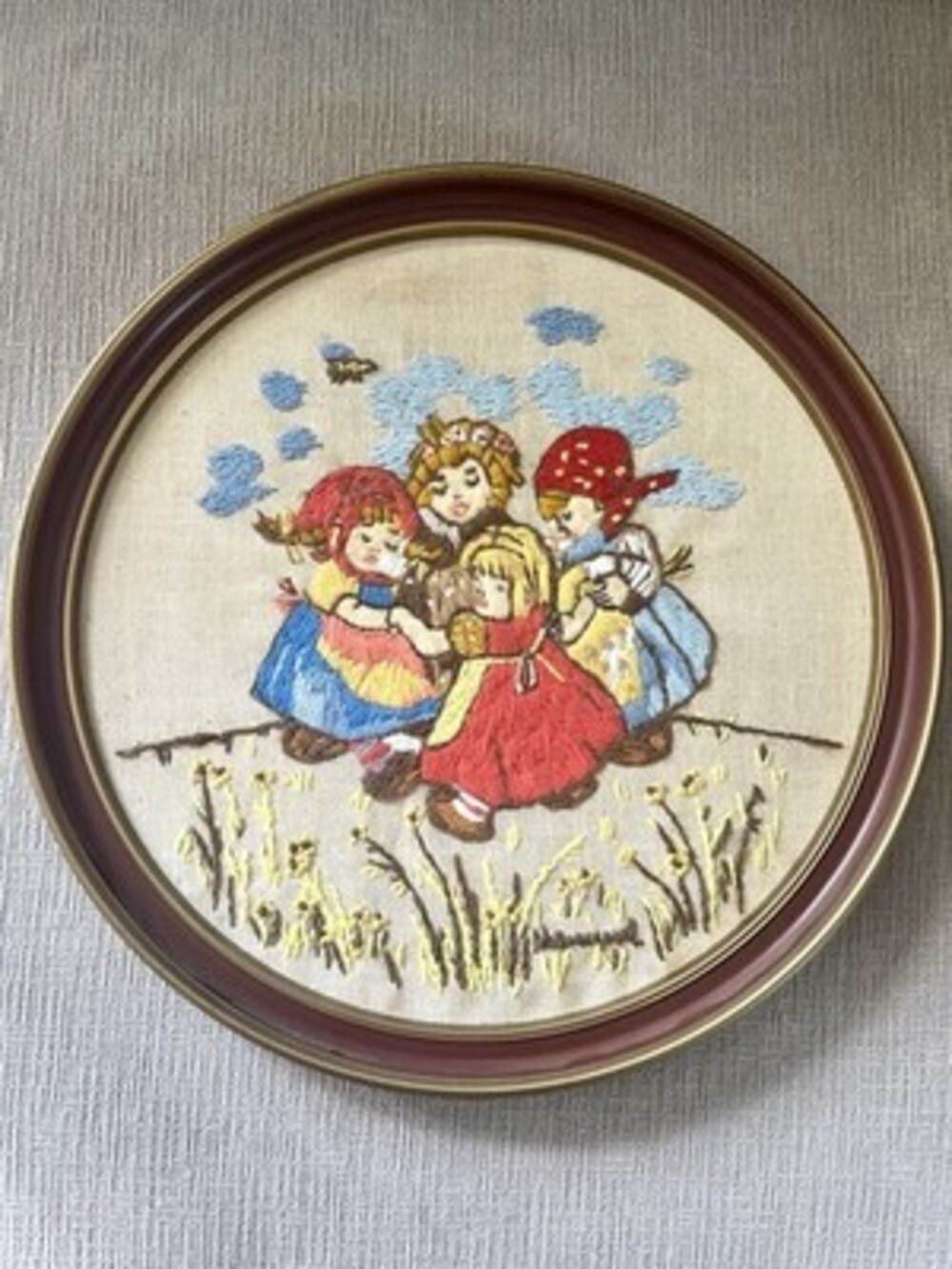Vintage needle point  Hummels embroidery . In a round frame.  13 Inches